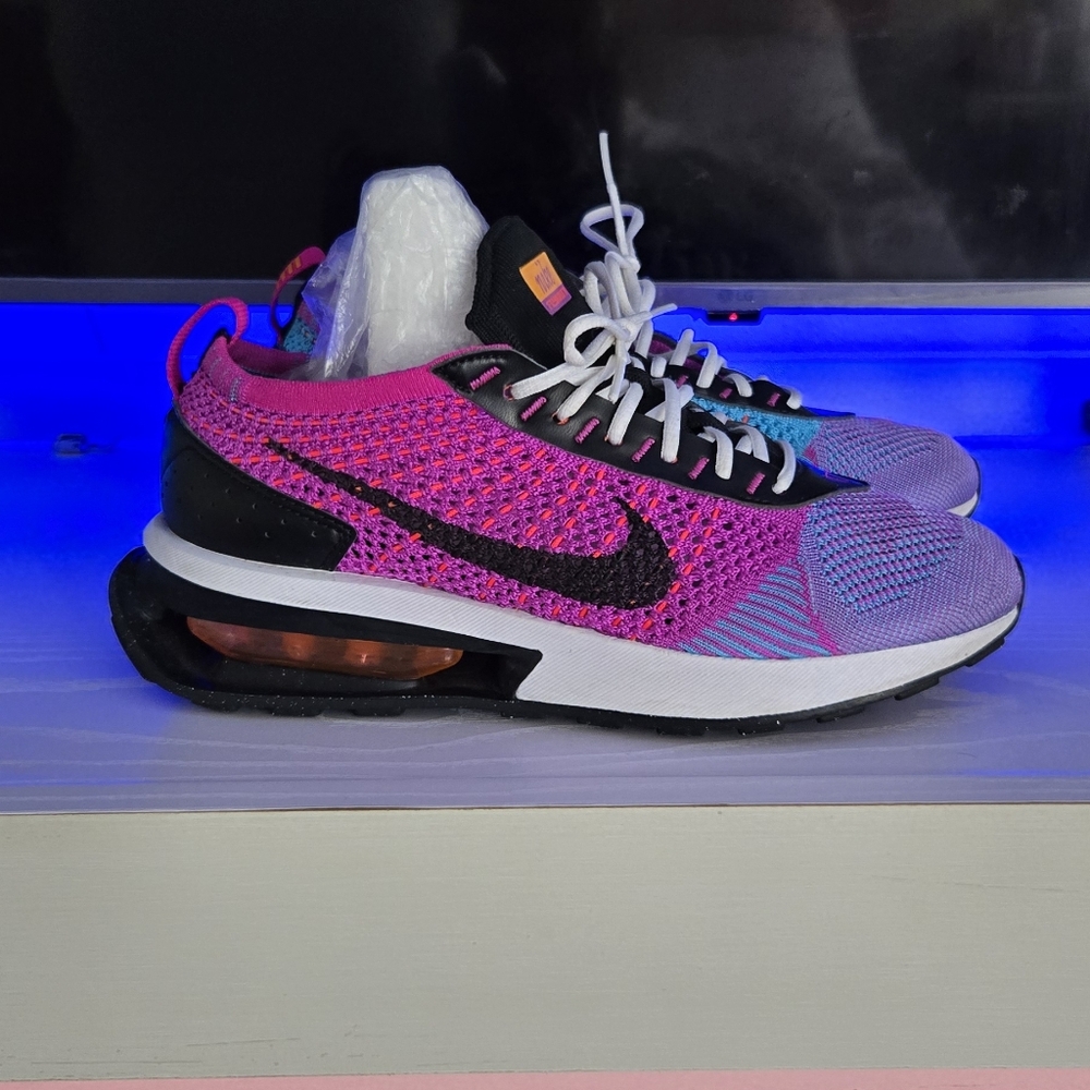 Nike Air Max Flyknit Racer Next Nature shoes in the Fuchsia Dream/Black colorway